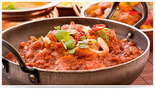 Chicken vindaloo and jalfrezi curries with pilau rice and Bombay aloo potato curry.